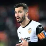 José Luis Gayà celebra su gol decisivo ante el Getafe CF junto a sus compañeros del Valencia CF en el Coliseum