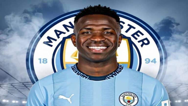 Montaje de Vinícius Jr. con la camiseta del Manchester City y el escudo del club de fondo.